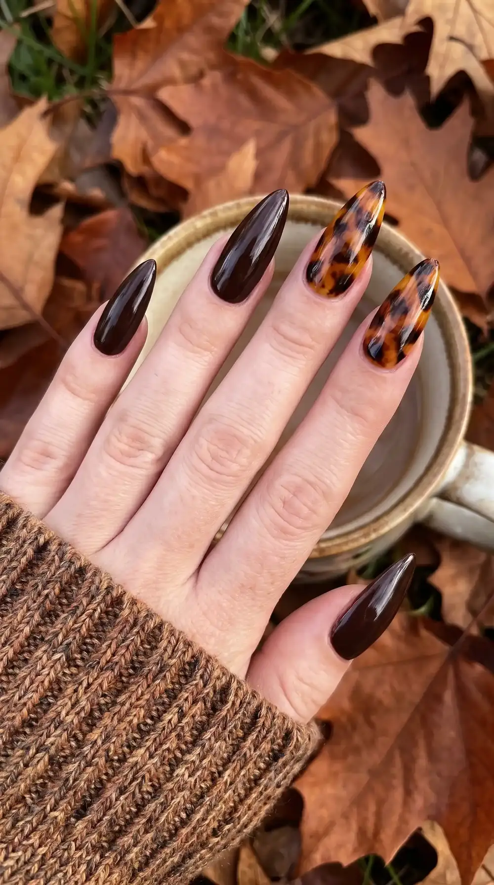Dark chocolate fall almond nails with tortoiseshell accent nails Dark chocolate fall almond nails with tortoiseshell accent nails
