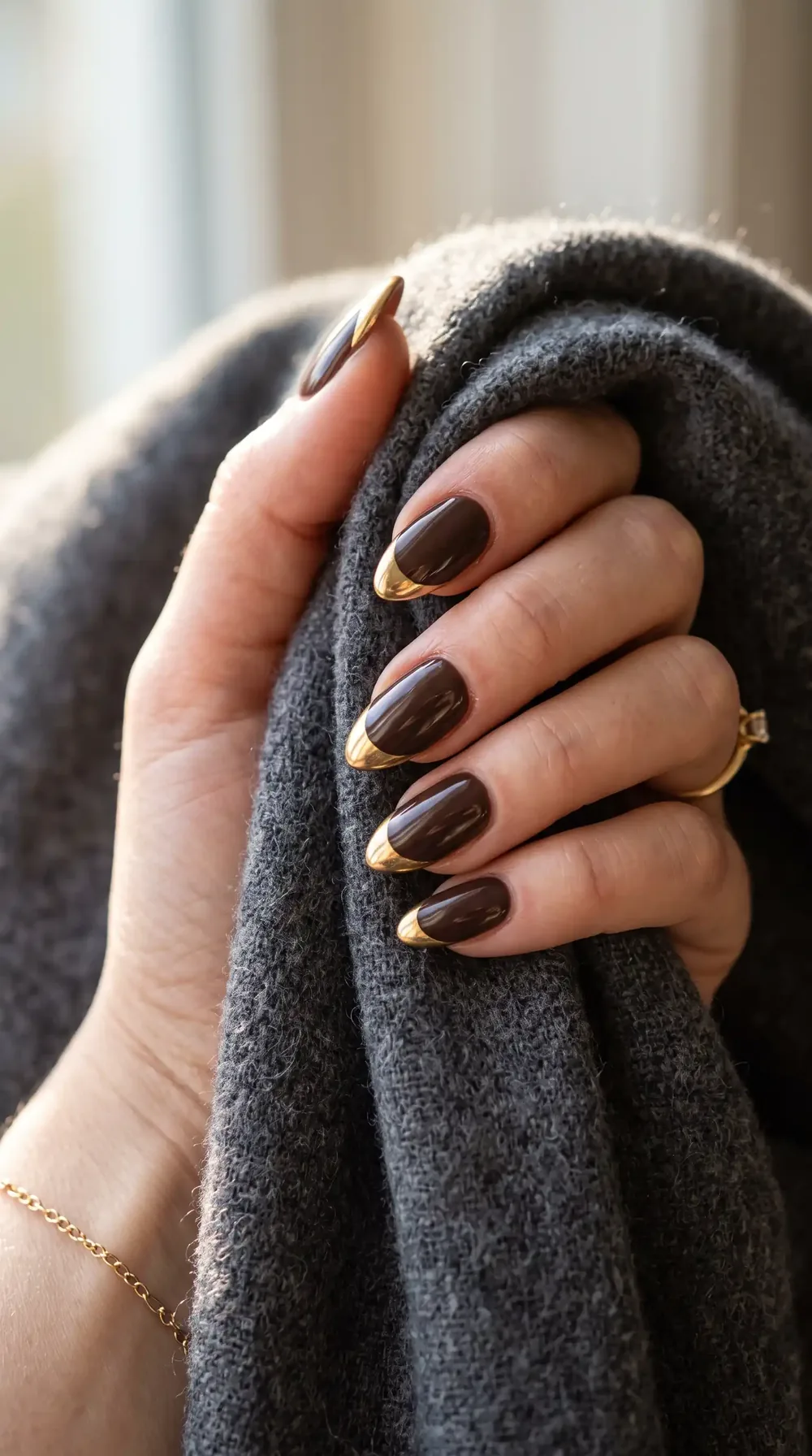 Dark plum fall almond nails with gold french tips Dark plum fall almond nails with gold french tips