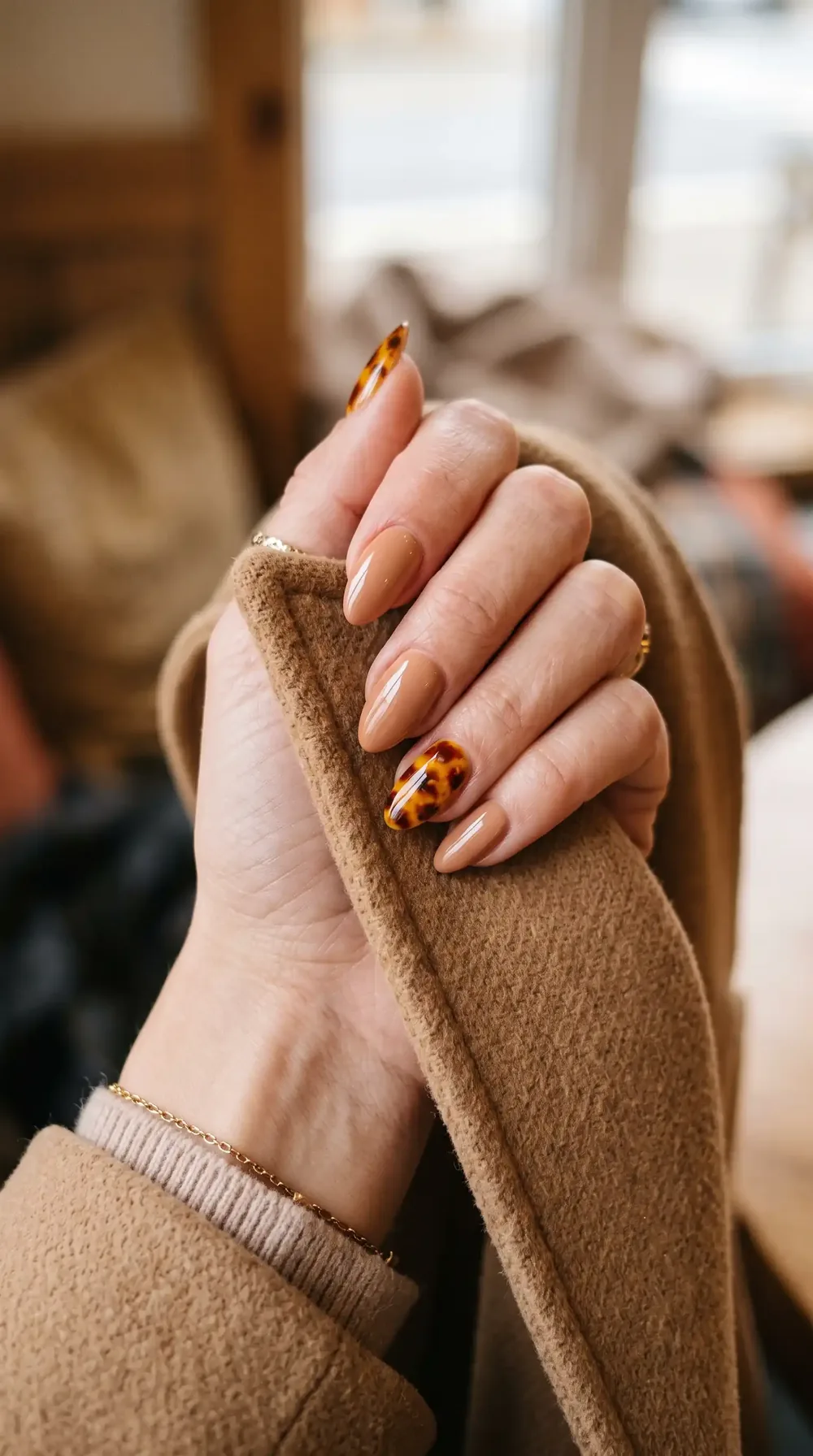 Nude fall almond nails with a tortoiseshell accent nail Nude fall almond nails with a tortoiseshell accent nail