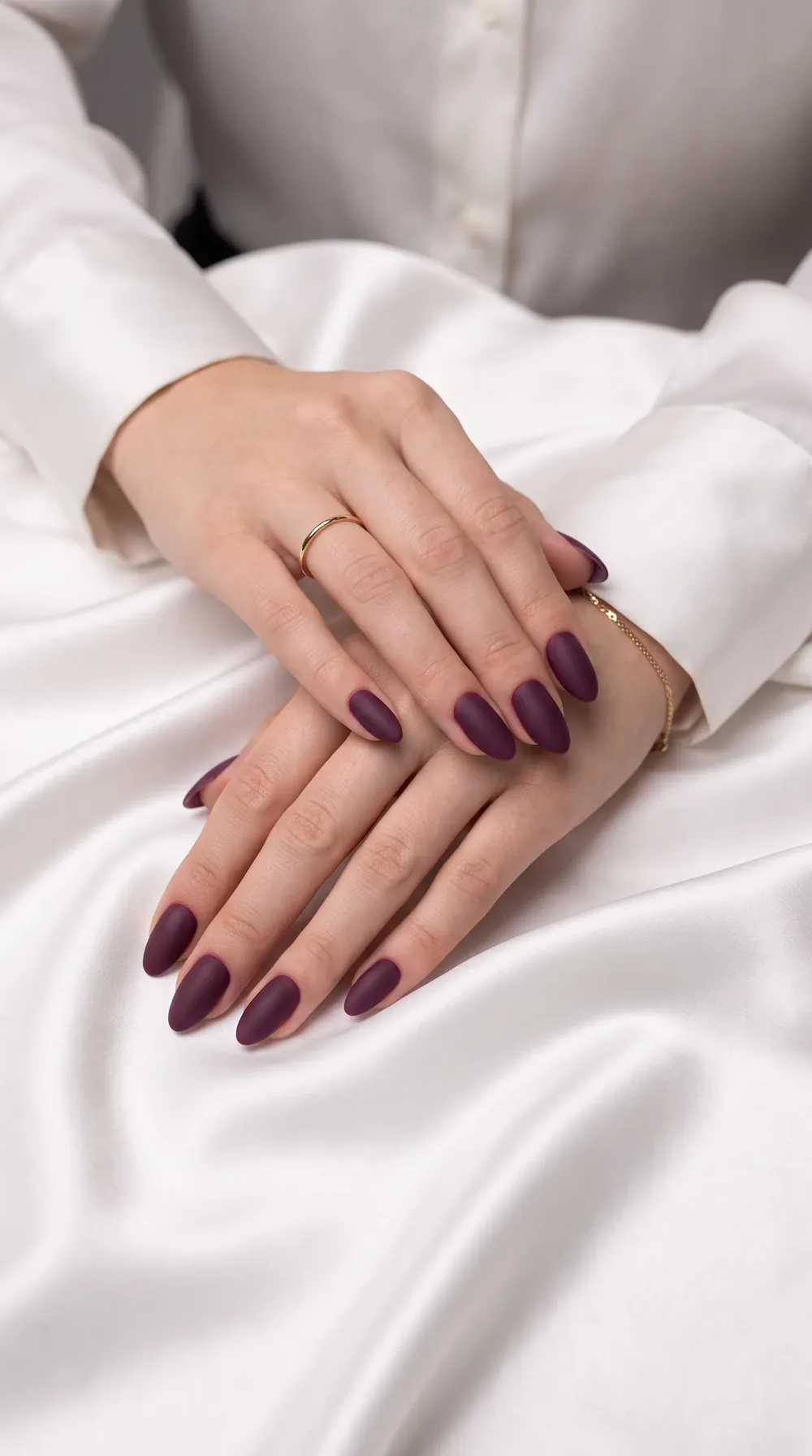 Deep plum velvet fall almond nails on white satin Deep plum velvet fall almond nails on white satin