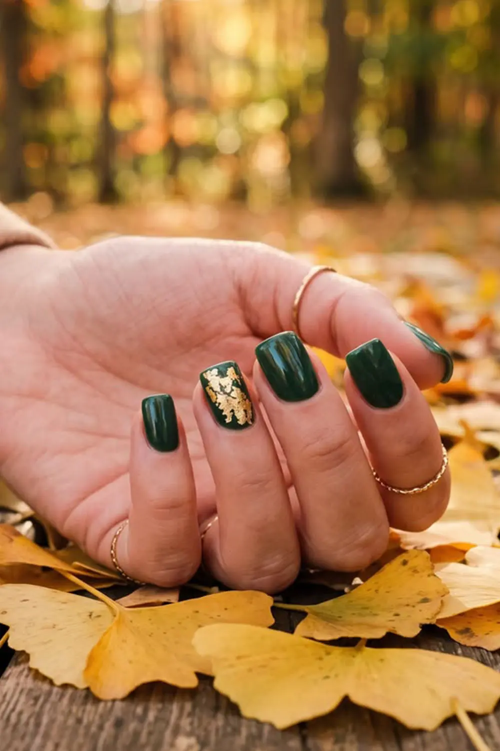Short forest green fall nails with a gold foil accent nail Short forest green fall nails with a gold foil accent nail
