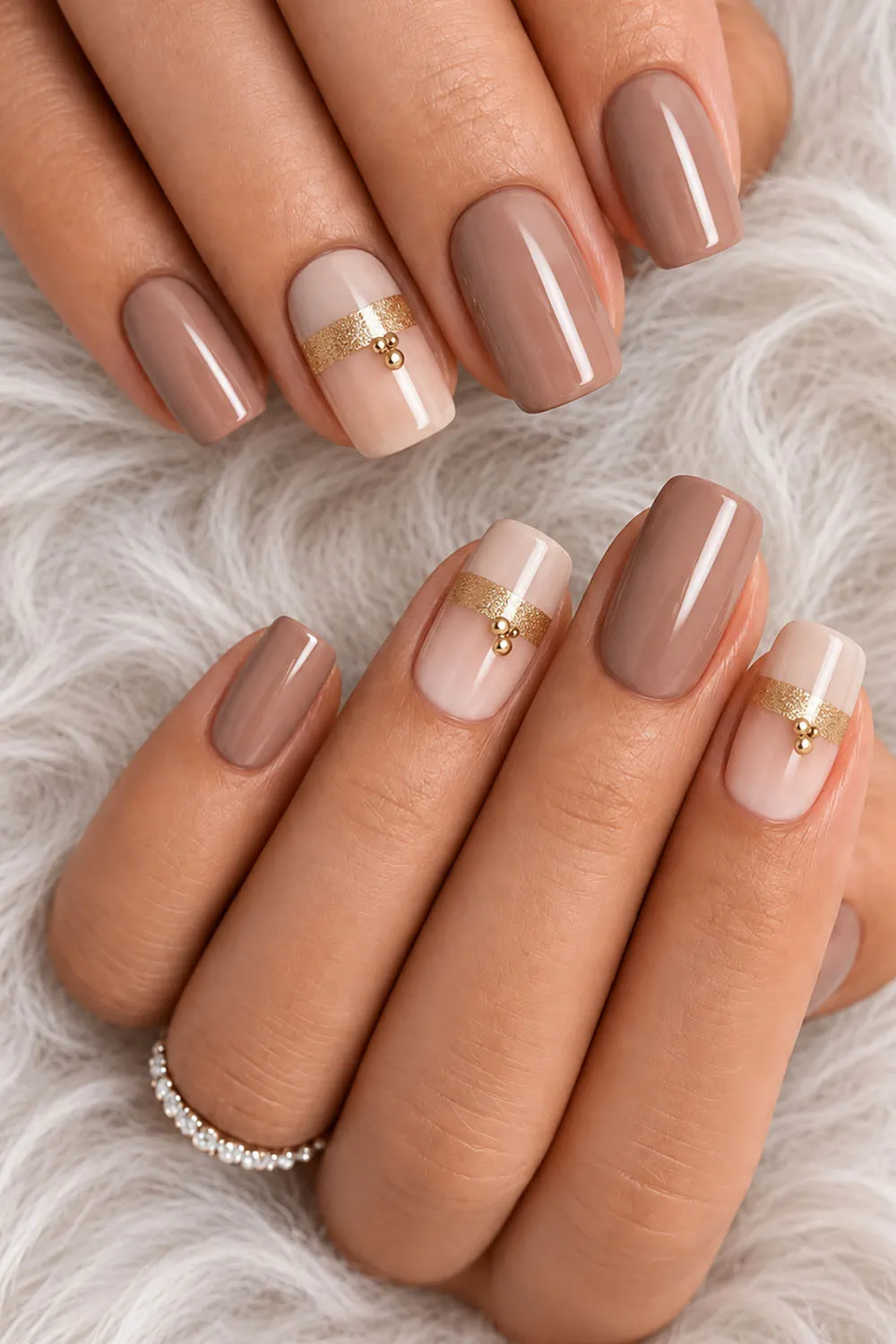 Short mauve nude nails with gold foil french tip accents Short mauve nude nails with gold foil french tip accents