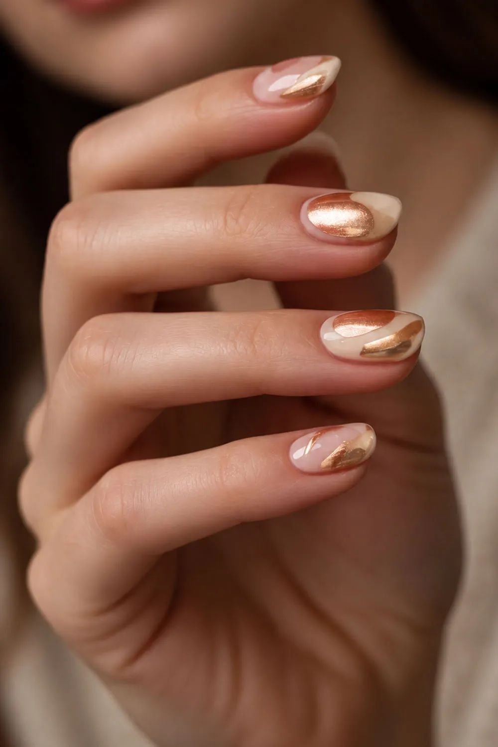 Short nude almond nails with a gold foil swirl accent nail Short nude almond nails with a gold foil swirl accent nail