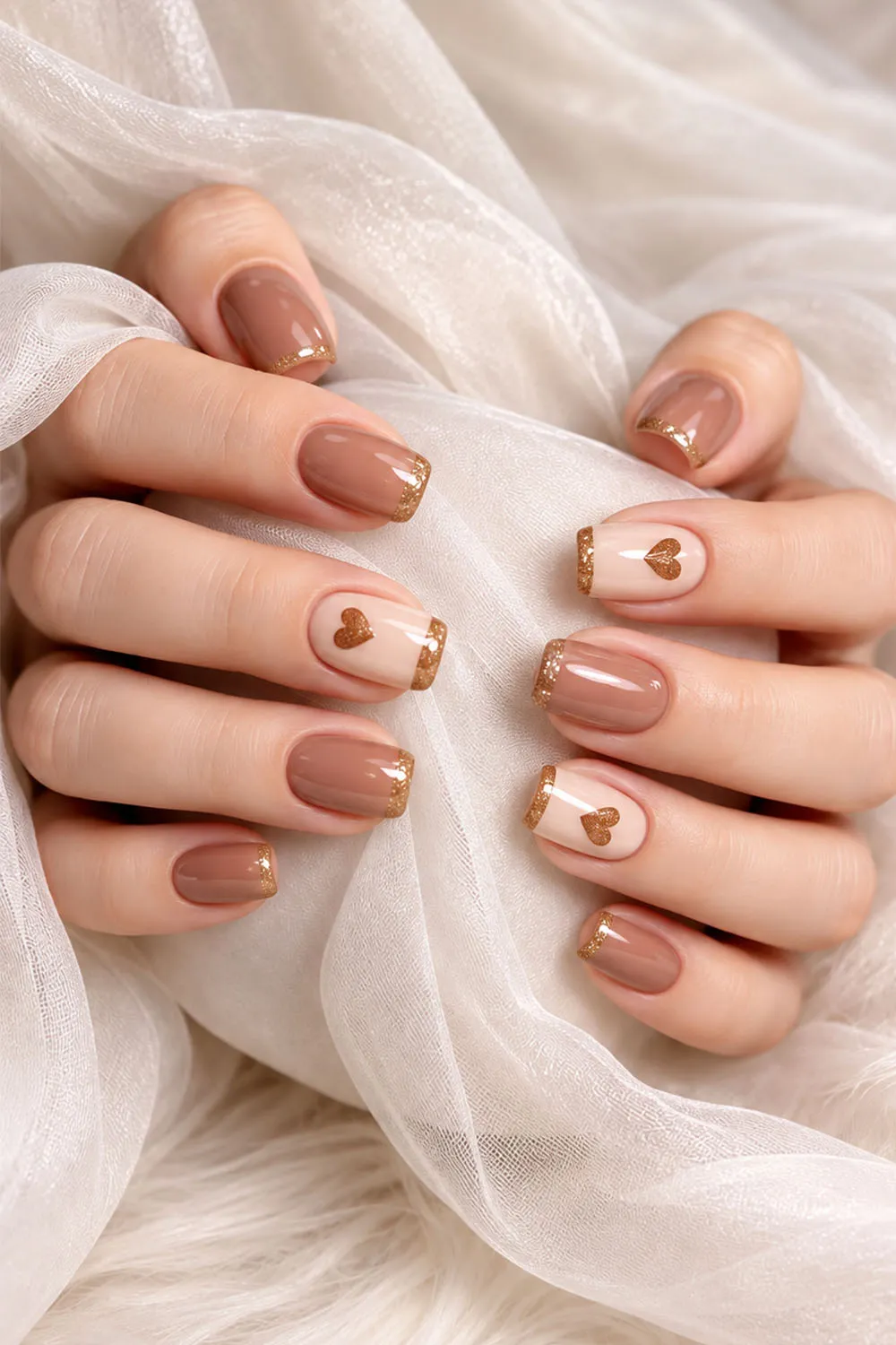 Warm nude short nails with small gold heart decals for autumn Warm nude short nails with small gold heart decals for autumn