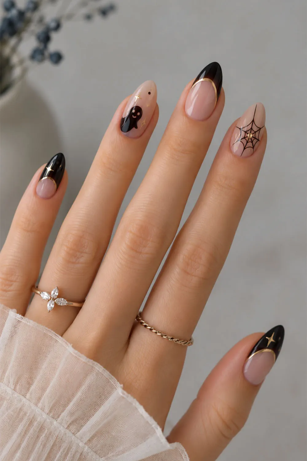 Nude short halloween nails with black french tips, spiderweb and spider details