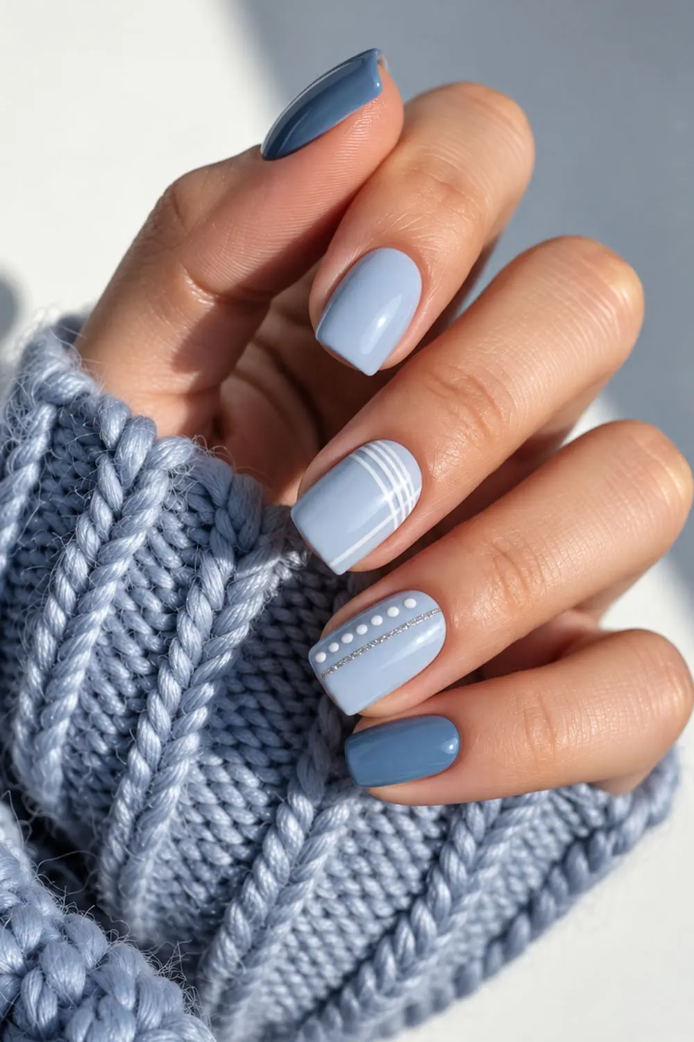 Blue summer nails with white stripes and dot details Blue summer nails with white stripes and dot details