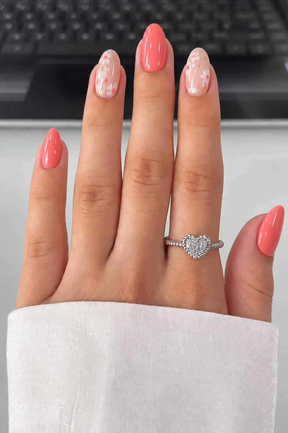 Coral summer nails with white swirl accent nails Coral summer nails with white swirl accent nails