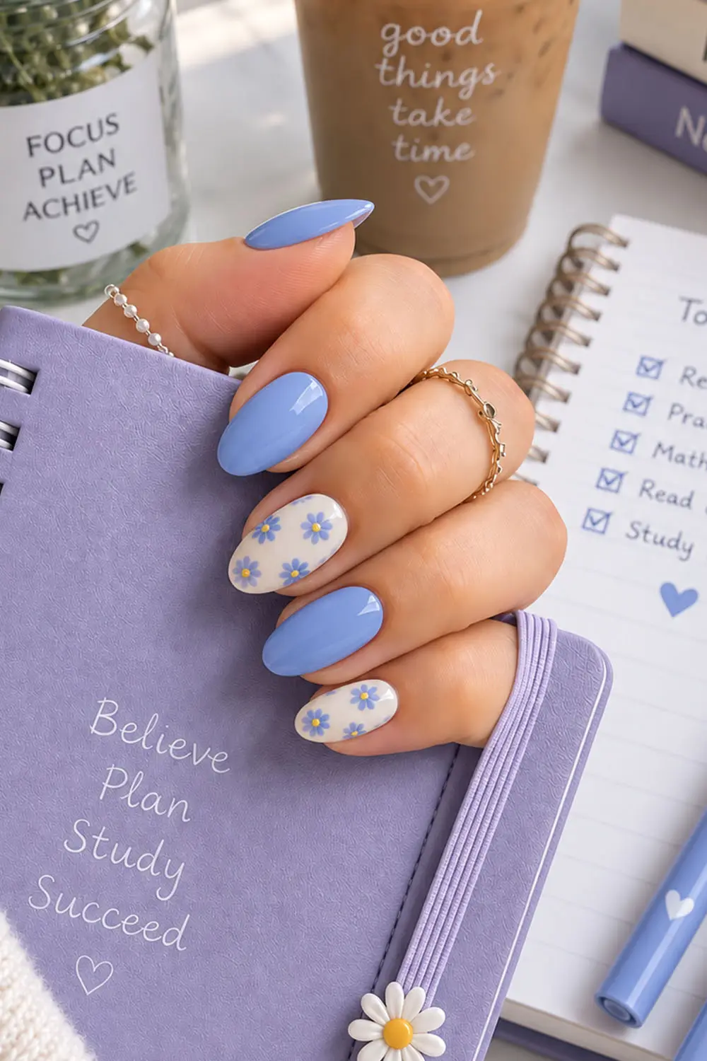 Cornflower blue summer nails with white daisy floral accents Cornflower blue summer nails with white daisy floral accents