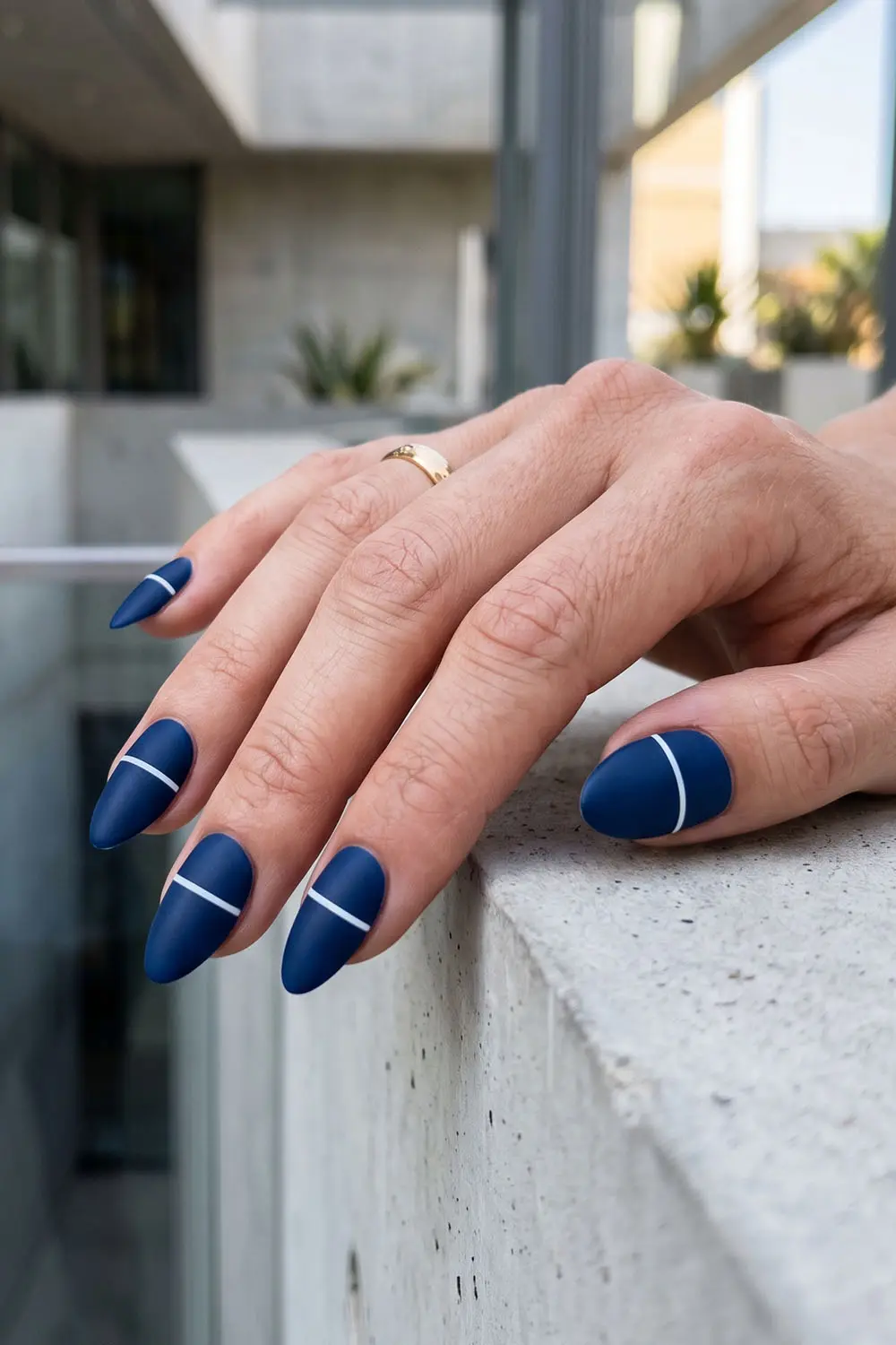 Navy blue summer nails with a fine white line detail Navy blue summer nails with a fine white line detail