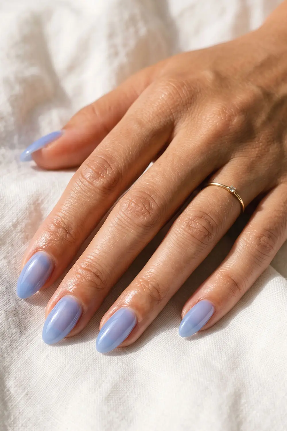 Soft periwinkle summer nails with a smooth glossy finish Soft periwinkle summer nails with a smooth glossy finish