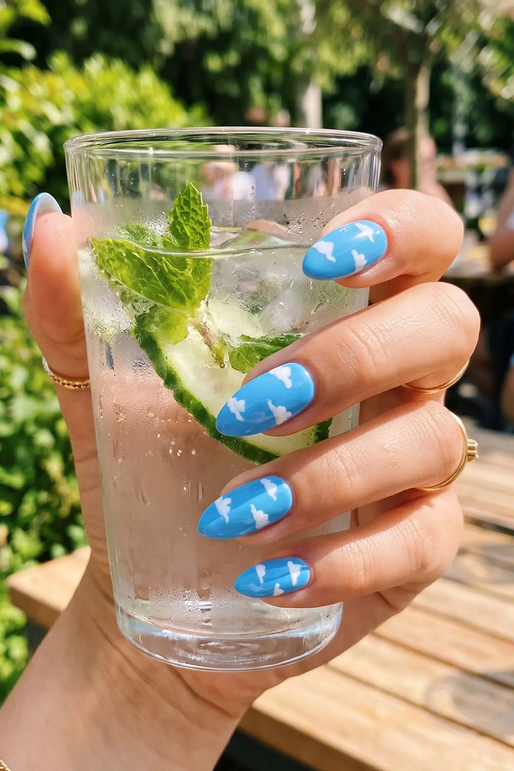 Sky blue summer nails with white cloud nail art Sky blue summer nails with white cloud nail art